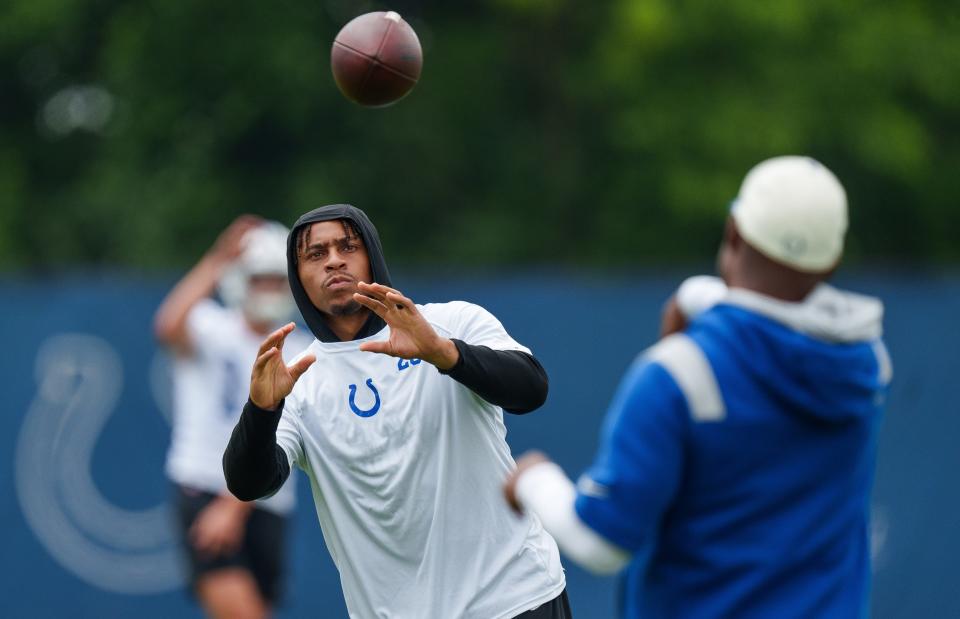 Indianapolis Colts running back Jonathan Taylor (28) passes on the sideline Wednesday, June 14, 2023, during mandatory minicamp at the Indiana Farm Bureau Football Center in Indianapolis.