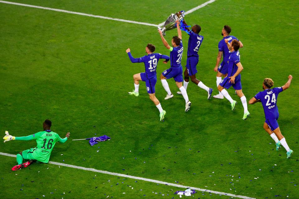 Chelsea players celebrate on the pitch (Getty Images)