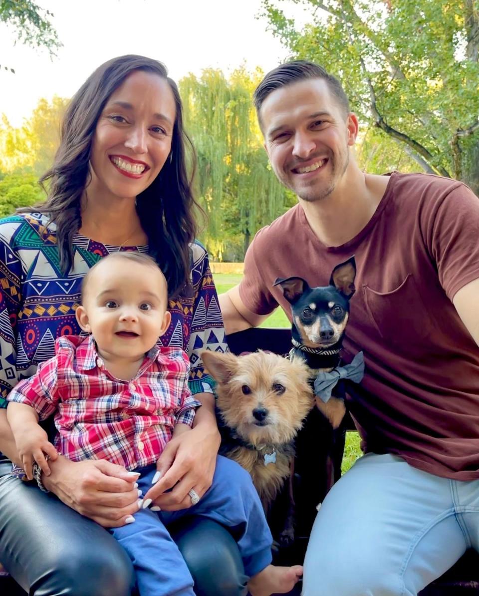 Couple with baby and two dogs