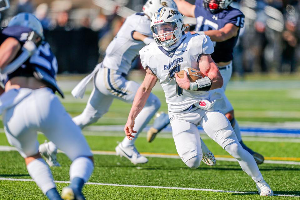 Heritage Hall’s Andy Bass (7) runs the ball against Marlow on Nov. 23 in Newcastle.