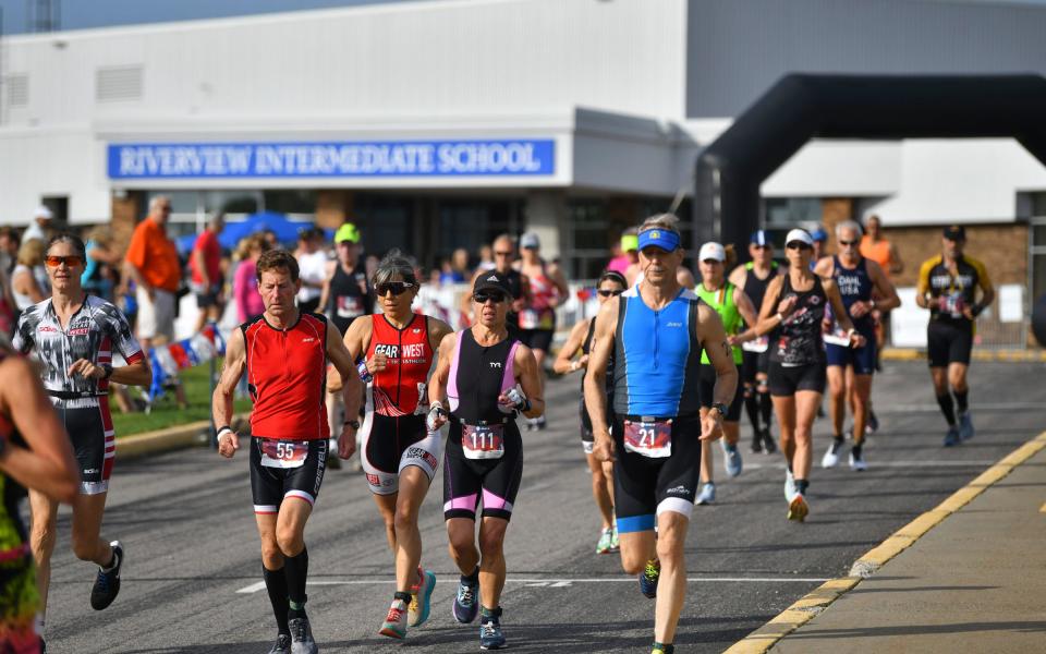 Runners start the course Saturday, May 22, 2021, during the Apple Duathlon in Sartell. 