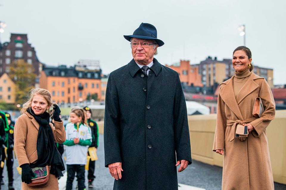 (R-L) Crown Princess Victoria of Sweden, King Carl Gustaf of Sweden and Princess Estelle are pictured on the golden bridge Slussbron after its inauguration in Stockholm on October 25, 2020.
