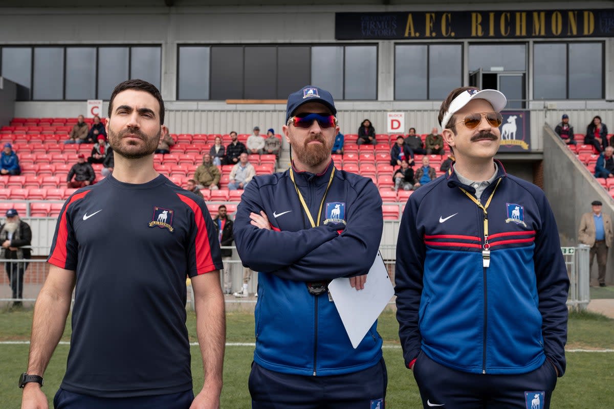 Jason Sudeikis plays Ted Lasso (right) an American football coach who ends up coaching AFC Richmond  (Apple TV+)