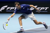 Daniil Medvedev of Russia returns the ball to Alexander Zverev of Germany during their singles final tennis match of the ATP World Tour Finals, at the Pala Alpitour in Turin, Italy, Sunday, Nov. 21, 2021. (AP Photo/Luca Bruno)