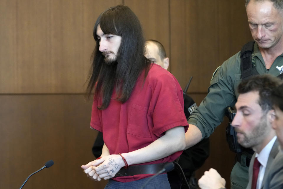 Robert E. Crimo III, is escorted into a courtroom during a case management conference before Judge Victoria A. Rossetti at the Lake County Courthouse Monday, Dec. 11, 2023, in Waukegan, Ill. Robert Crimo III, accused of killing seven and wounding dozens more at a Fourth of July parade in 2022, asked a Lake County judge to allow him to continue without the aid of his assistant public defenders and invoked his right to a speedy trial. (AP Photo/Nam Y. Huh, Pool)