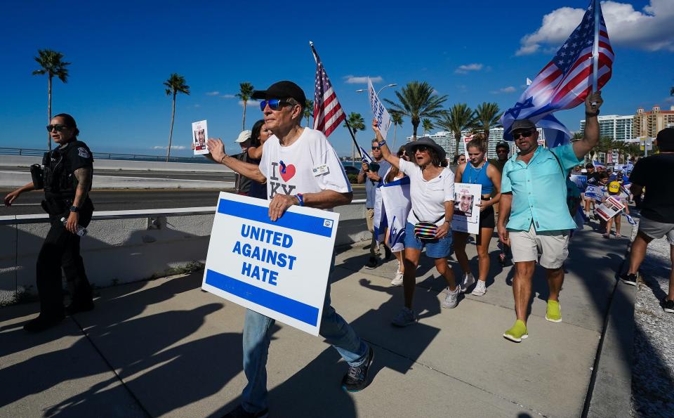 Hundreds walk over the John Ringling Causeway in Sarasota in the March against Hate-Bring the Hostages Home rally in November 2023. They were demanding the release of hostages taken by Hamas in its Oct. 7 attack on Israel. 100 are still captive.