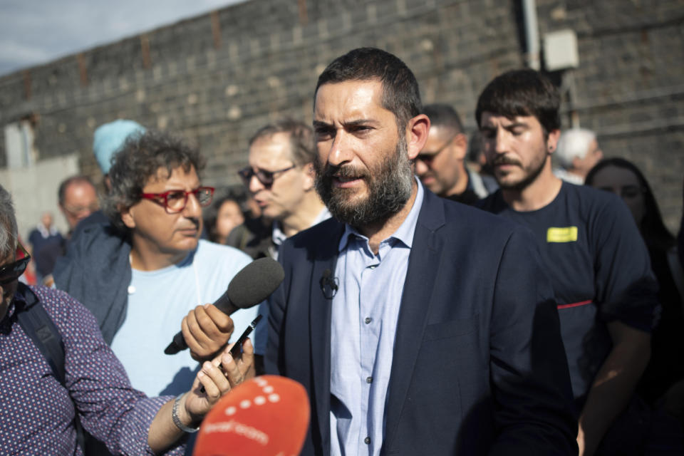 Riccardo Campochiaro, lawyer of the German charity organization SOS Humanitarian, talks to reporters during a press conference at the port of Catania, Sicily, southern Italy, Monday, Oct. 7, 2022. The captain of the German organization's rescue ship, the Humanity 1, refused Italian orders to leave the Sicilian port Sunday after Italian authorities refused to let 35 of the migrants on his ship disembark — part of directives by Italy's new far-right-led government targeting foreign-flagged rescue ships. (AP Photo/Salvatore Cavalli)