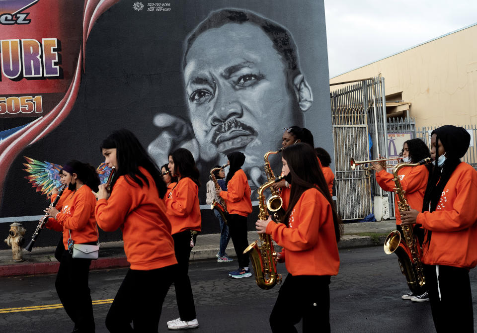 Music students from the Kipp Scholar Academy prepare to participate in the Kingdom Day Parade in Los Angeles, Monday, Jan. 16, 2023. After a two-year hiatus because of the COVID-19 pandemic, the parade, America's largest Martin Luther King Day celebration, returned. (AP Photo/Richard Vogel)