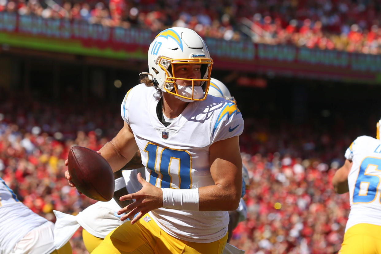 KANSAS CITY, MO - SEPTEMBER 26: Los Angeles Chargers quarterback Justin Herbert (10) rolls out in his own end zone in the first quarter of an AFC West matchup between the Los Angeles Chargers and Kansas City Chiefs on Sep 26, 2021 at GEHA Filed at Arrowhead Stadium in Kansas City, MO. (Photo by Scott Winters/Icon Sportswire via Getty Images)