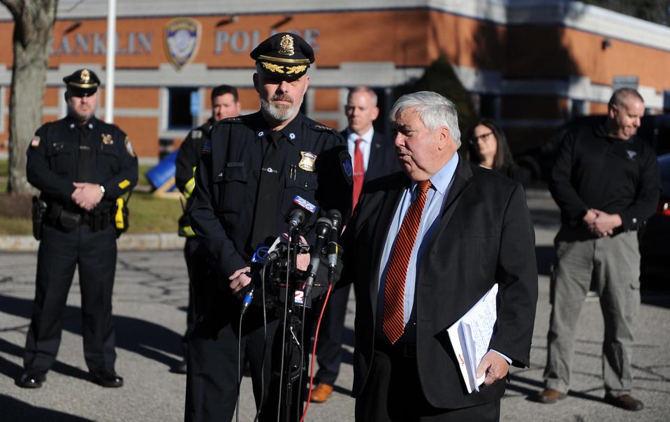 Franklin Police Chief Thomas Lynch and Norfolk District Attorney Michael Morrisey speak during a press conference Friday outside Franklin Police Headquarters after a fatal fire earlier in the day at 11 Grace Lane.