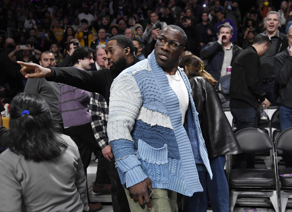 LOS ANGELES, CA - JANUARY 20: Shannon Sharpe is restrained by security after a verbal altercation with Tee Morant, father of Ja Morant #12 of the Memphis Grizzlies, during halftime against the Los Angeles Lakers at Crypto.com Arena on January 20, 2023 in Los Angeles, California.  NOTE TO USER: User expressly acknowledges and agrees that, by downloading and or using this photograph, User is consenting to the terms and conditions of the Getty Images License Agreement.  (Photo by Kevork Djansezian/Getty Images)