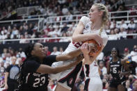 Stanford forward Cameron Brink, right, takes the ball away from South Carolina guard Bree Hall (23) during the first half of an NCAA college basketball game in Stanford, Calif., Sunday, Nov. 20, 2022. (AP Photo/Godofredo A. Vásquez)