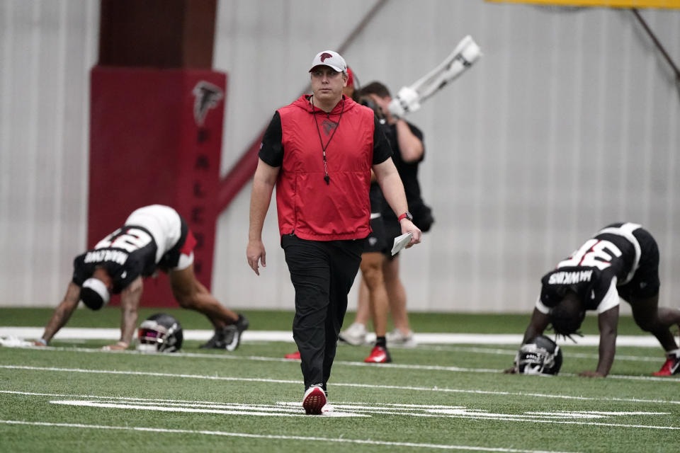 Atlanta Falcons head coach Arthur Smith walks across the field during NFL football practice Thursday, May 26, 2022, in Flowery Branch, Ga. (AP Photo/John Bazemore)