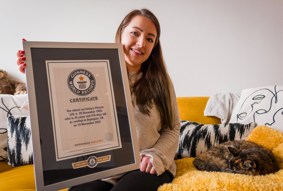 Flossie, pictured with new owner Vicki Green, is officially the oldest cat in the world. (Cats Protection/Guinness World Records)
