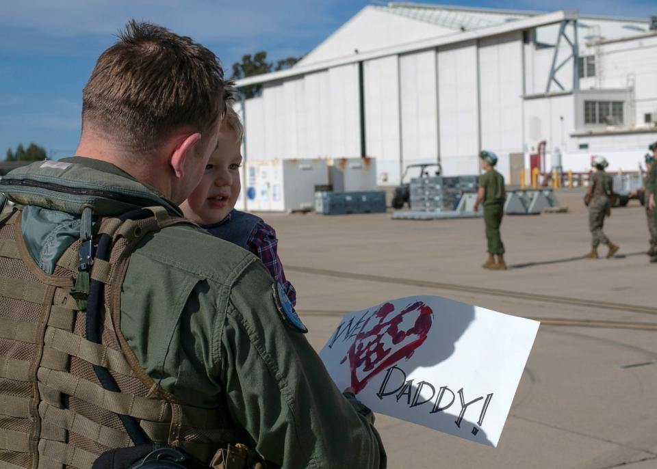 PHOTO: U.S. Marine Corps Maj. Andrew Mettler, an F/A-18 pilot, holds his son at Marine Corps Air Station in Miramar, Calif., on March 15, 2019, following a six-month Unit Deployment Program in Japan. (U.S. Marine Corps)