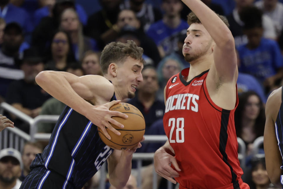 Orlando Magic forward Franz Wagner (22) drives against Houston Rockets center Alperen Sengun (28) during the first half of an NBA basketball game, Monday, Nov. 7, 2022, in Orlando, Fla. (AP Photo/Kevin Kolczynski)