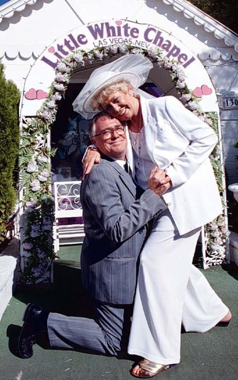 Jack (Bill Tarmey) goes down on one knee as he asks Vera (Liz Dawn) to tie the knot again during the filming of a Coronation Street Video Special in Las Vegas. - Credit: Dave Kendall/PA