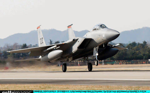 US Air Force F-15 fighter jet touching down at Gwangju Air Base on December 1, 2017 in Gwangju, South Korea. - Credit: Handout