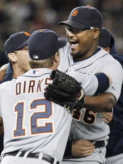 Tigers closer Jose Valverde is mobbed by teammates after striking out Alex Rodriguez to record the final out of the ALDS in New York