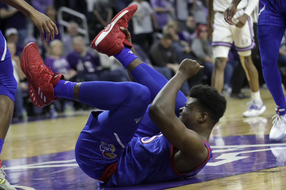 Kansas center Udoka Azubuike (35) lands with an injured ankle during the first half of an NCAA college basketball game against Kansas State in Manhattan, Kan., Saturday, Feb. 29, 2020. (AP Photo/Orlin Wagner)