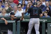 Miami Marlins manager Don Mattingly, left, congratulates Adam Duvall after his grand slam during the third inning of the team's baseball game against the Chicago Cubs in Chicago, Friday, June 18, 2021. (AP Photo/Nam Y. Huh)