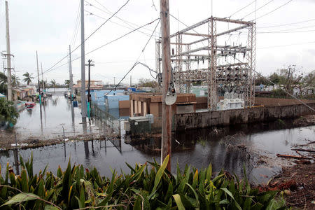 FILE PHOTO: A neighbourhood is flooded after the area was hit by Hurricane Maria in Catano municipality, southwest of San Juan, Puerto Rico on September 21, 2017. REUTERS/Alvin Baez/File Photo