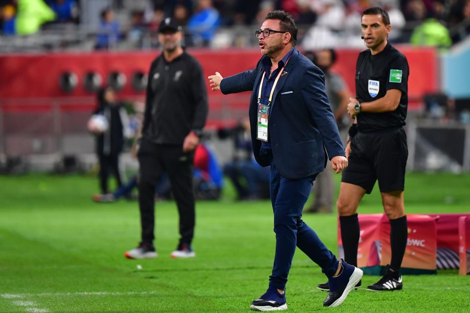 Monterrey's coach Antonio Mohamed (C) points at Liverpool's German manager Jurgen Klopp (L) during the 2019 FIFA Club World Cup semi-final football match between Mexico's Monterrey and England's Liverpool at the Khalifa International Stadium in the Qatari capital Doha on December 18, 2019. (Photo by Giuseppe CACACE / AFP) (Photo by GIUSEPPE CACACE/AFP via Getty Images)