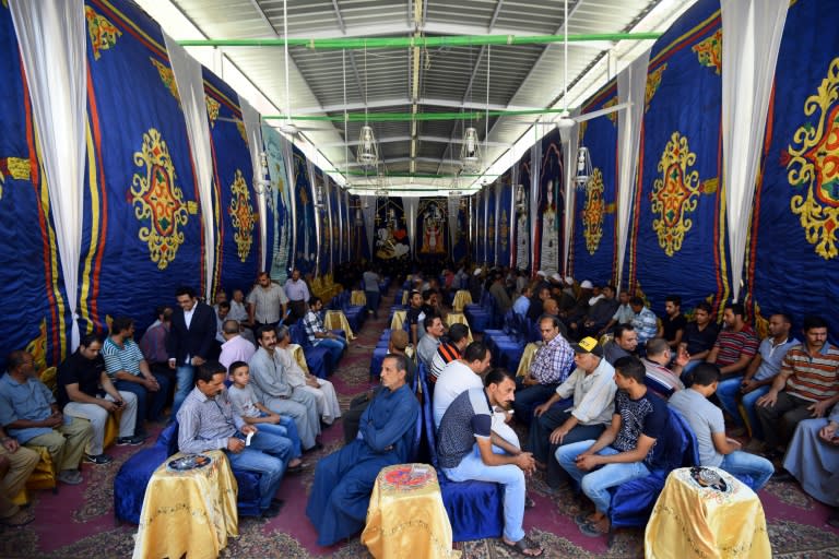 Egyptian mourners attend a memorial service at St Mark's Coptic Orthodox Cathedral in Bani Mazar on May 27, 2017, a day after the bus massacre for the 29 people gunned down by masked gunmen in a bus attack the day before