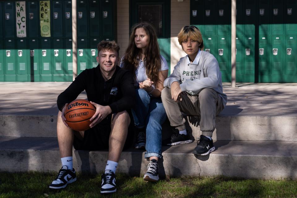 From left, Antonio Horvat, Sasha Danyliuk, and Kim "KB" Kyubo pose for a portrait at Phoenix Christian Preparatory School on Wednesday, Jan. 4, 2023, in Phoenix. The three students are unable to play on the schools varsity basketball team due to AIA international transfer rules.