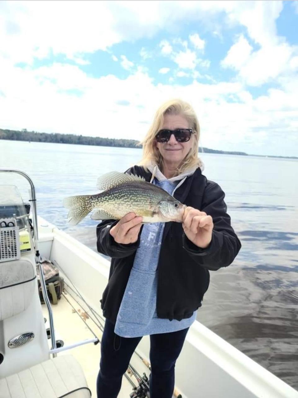 Julie Happersett shows off a nice Lake Talquin crappie caught this past week while fishing with Florida Panhandle Outdoors.