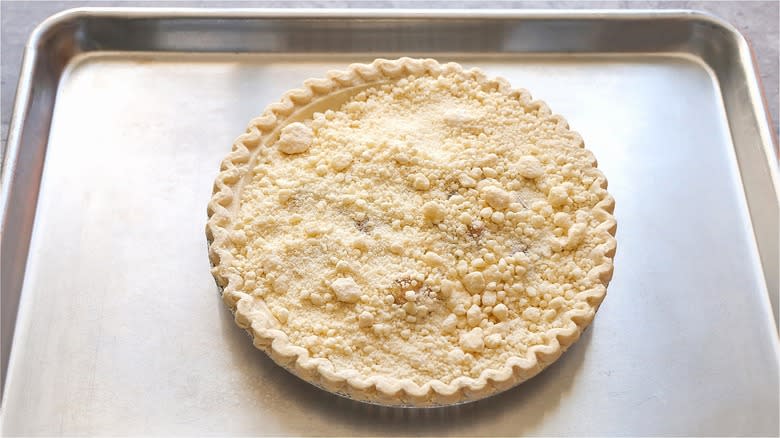 Uncooked pie on metal baking sheet 