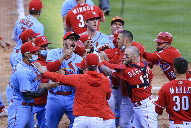 Reds scrap with Cards at plate, tangle in outfield, win 9-6