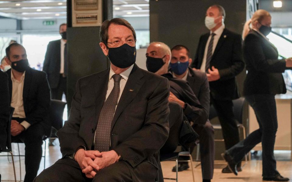 Nicos Anastasiades looking on before members of his cabinet receive doses of the AstraZeneca vaccine - Amir Makar/AFP