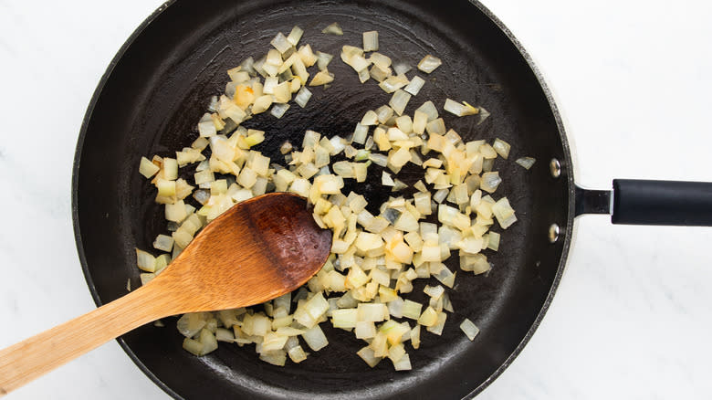 onion frying in pan