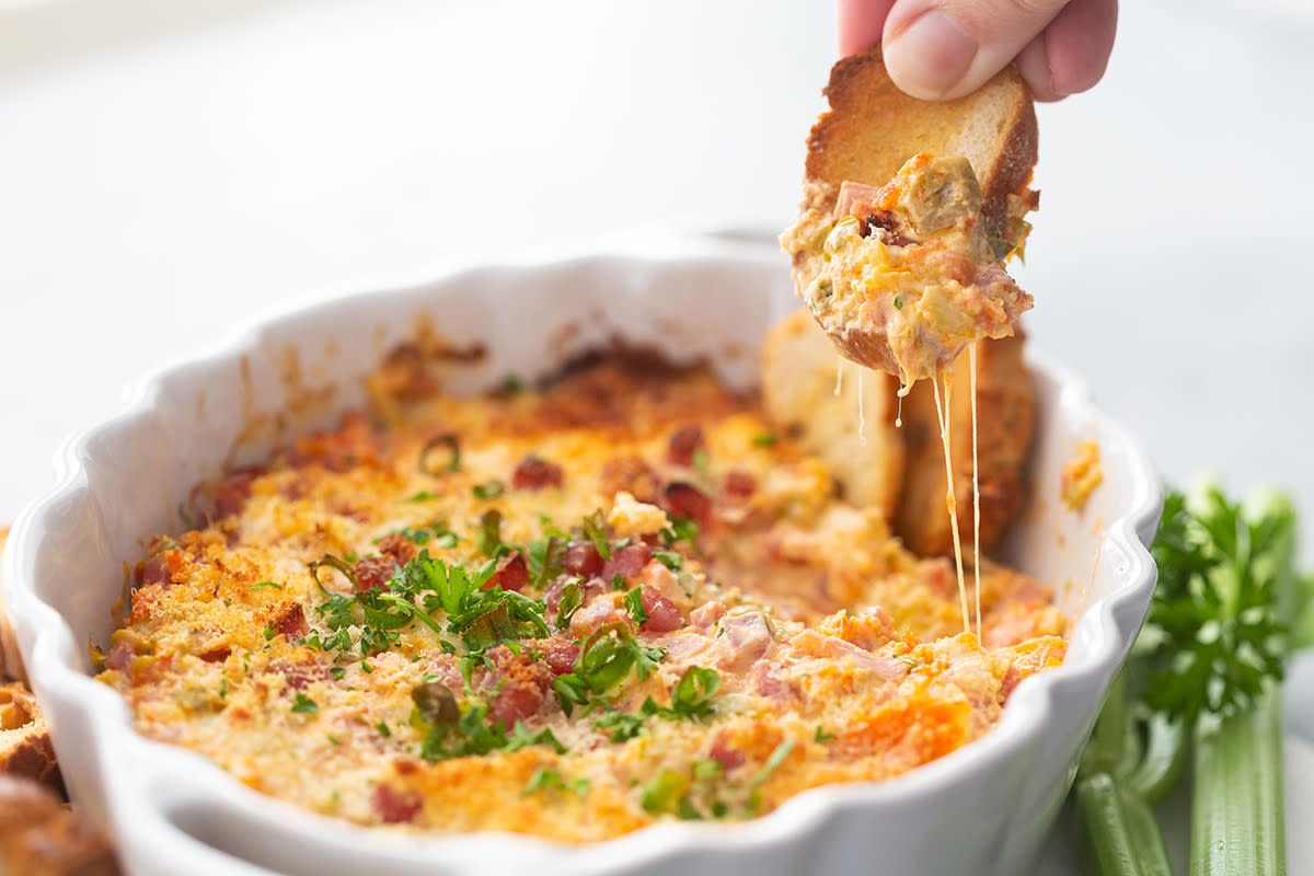 <p>Best Appetizers</p><p>Inspired by the classic New Orleans Muffuletta Sandwich, this Baked Muffuletta Dip is cheesy, delicious and makes the perfect appetizer!</p><p><strong>Get the recipe: <a href="https://bestappetizers.com/baked-muffuletta-dip/" rel="nofollow noopener" target="_blank" data-ylk="slk:Baked Muffuletta Dip;elm:context_link;itc:0;sec:content-canvas" class="link rapid-noclick-resp">Baked Muffuletta Dip</a></strong></p>