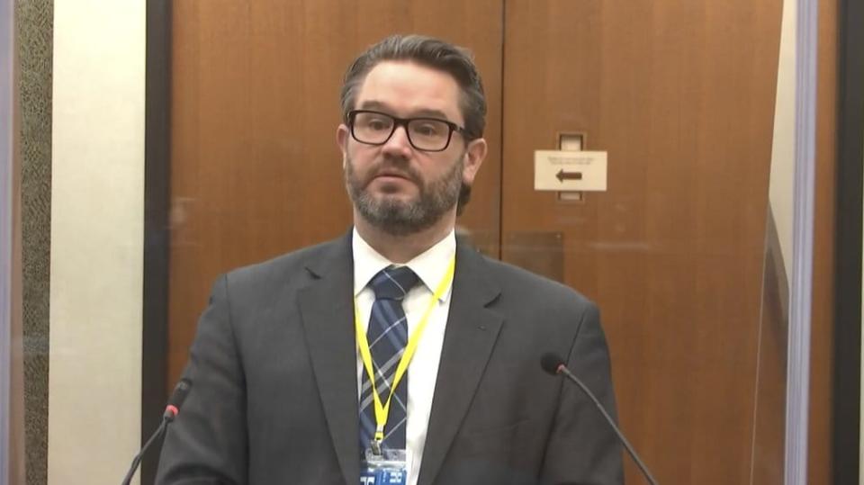 In this image from video, defense attorney Eric Nelson questions Dr. Lindsey Thomas, a forensic pathologist, now retired, as Hennepin County Judge Peter Cahill presides Friday, April 9, 2021, in the trial of former Minneapolis police Officer Derek Chauvin at the Hennepin County Courthouse in Minneapolis. (Court TV via AP, Pool, File)