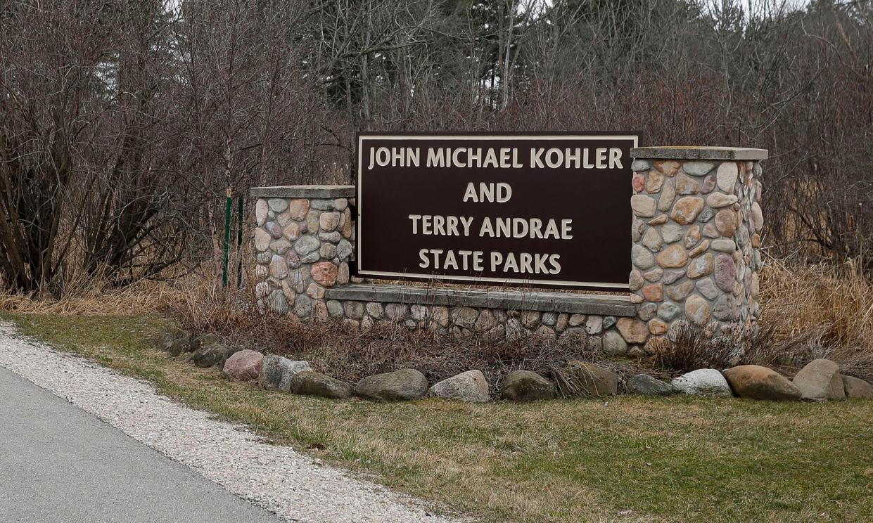 A new sign appears at the entrance Kohler-Andrae State Park, Thursday, March 21, 2024, in Sheboygan, Wis. The Previous sign said, “Kohler-Andrae State Park” while the new sign says, “John Michael Kohler and Terry Andrae State Parks”.