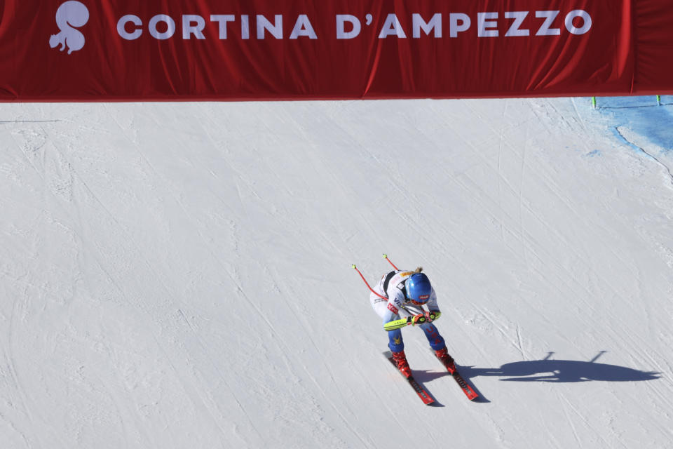 United States' Mikaela Shiffrin crosses the finish line of an alpine ski, women's World Cup super-G race in Cortina d'Ampezzo, Italy, Sunday, Jan. 23, 2022. (AP Photo/Alessandro Trovati)