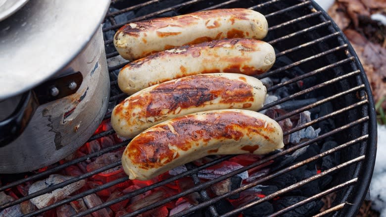 roast sausages on charcoal grill