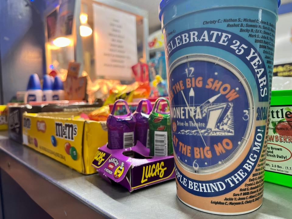 A souvenir cup celebrating the 25th anniversary Monetta Drive-In Theatre, also known as "The Big Mo," in Monetta, S.C. is sold alongside all of the rest of the snacks on site. The cup has the names of everyone who has worked at the drive-in.