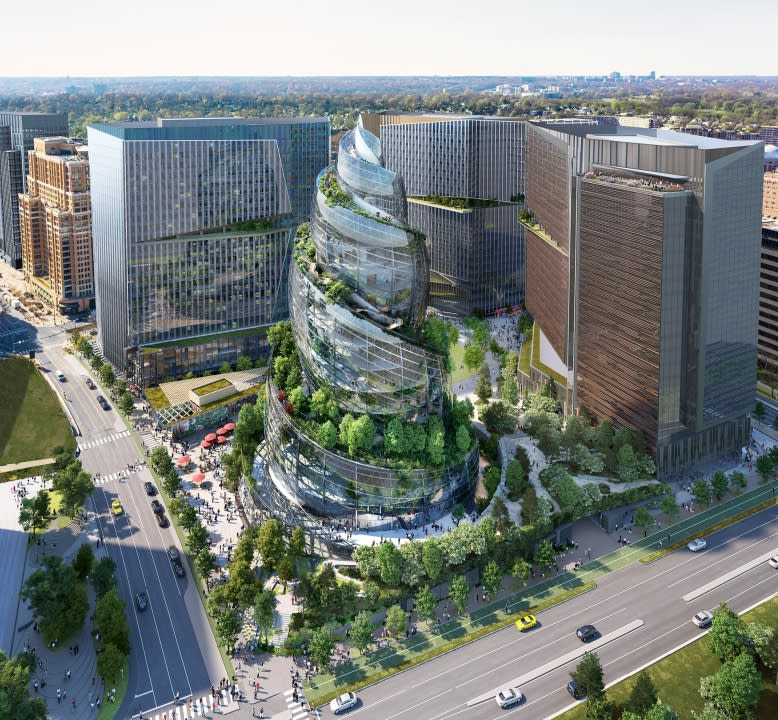 This artist rendering provided by Amazon shows the next phase of the company’s headquarters redevelopment to be built in Arlington, Va. The Arlington County Board gave approval April 23, 2022, to Amazon’s plans to build a unique, helix-shaped tower as the centerpiece of its emerging second headquarters in northern Virginia. (NBBJ/Amazon via AP)