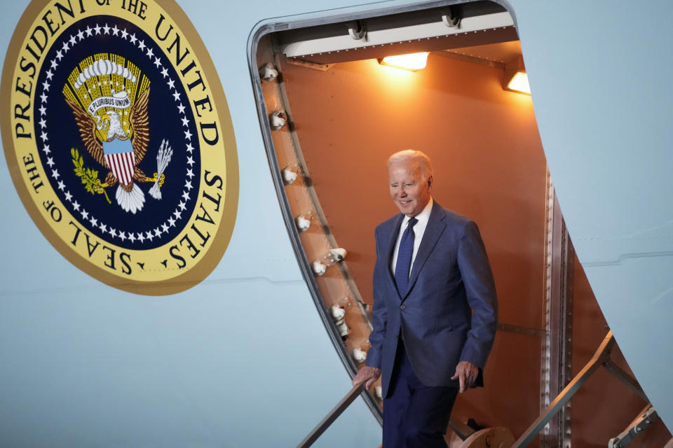 President Joe Biden steps off Air Force One at Belfast International Airport in Belfast, Northern Ireland, Tuesday, April 11, 2023. Biden is visiting the United Kingdom and Ireland in part to help celebrate the 25th anniversary of the Good Friday Agreement. (AP Photo/Patrick Semansky)