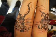 <div class="caption-credit"> Photo by: larsonstattooing.com</div><div class="caption-title">The Greatest Catch of All</div>Yes, there are many fish in the sea. But judging by this couples ink, I'd say they each landed the right one. <br> <b><i><a href="http://www.babble.com/strollerderby/2012/05/01/25-things-women-will-never-understand-about-men/?cmp=ELP|bbl|lp|YahooShine|Main||011613|||famE|||" rel="nofollow noopener" target="_blank" data-ylk="slk:Related: 25 things women will NEVER understand about men;elm:context_link;itc:0;sec:content-canvas" class="link ">Related: 25 things women will NEVER understand about men</a></i></b>