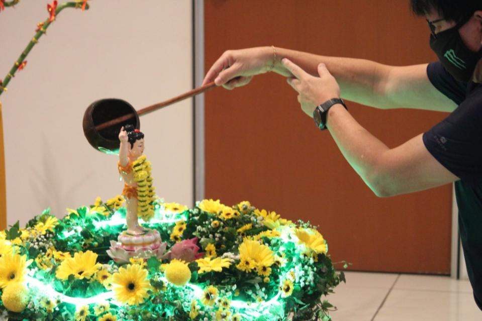 A devotee performs the Buddha bathing ritual during last year’s Wesak celebration. — Picture courtesy of Ti-Ratana Buddhist Society