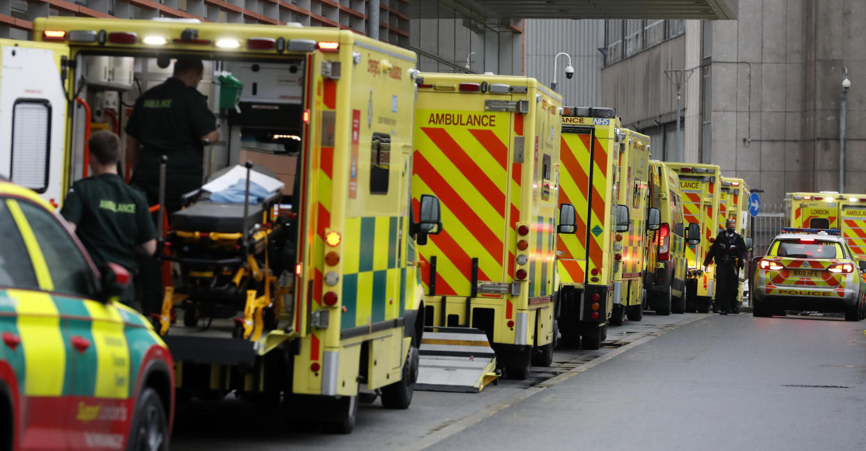 Ambulances queue at the Royal London Hospital in London, Wednesday, Jan. 13, 2021 during England's third national lockdown to curb the spread of coronavirus. (AP Photo/Alastair Grant)