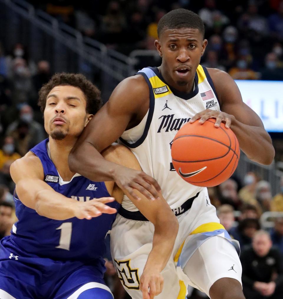 Marquette guard Darryl Morsell forces his way past Seton Hall guard Bryce Aiken during the first half Saturday at Fiserv Forum. Morsell scored 26 points, tying a college high he set earlier this season.