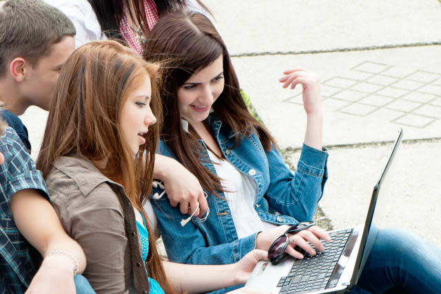 Students watching at laptop