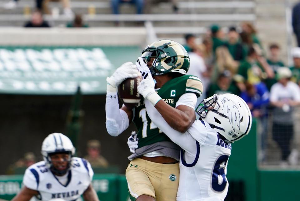 Nov 18, 2023; Fort Collins, Colorado, USA; Colorado State Rams wide receiver Tory Horton (14) tries to make a catch in the second quarter against the Nevada Wolf Pack at Sonny Lubick Field at Canvas Stadium. Mandatory Credit: Michael Madrid-USA TODAY Sports