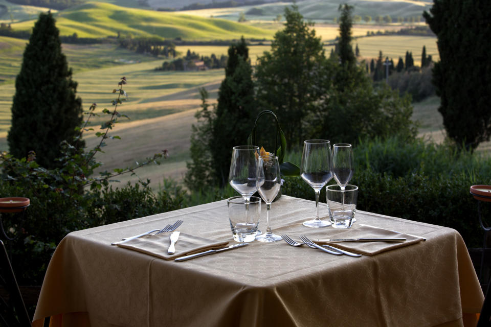 Table with a view of the beautiful landscapes of Val d'Orcia valley in Tuscany.