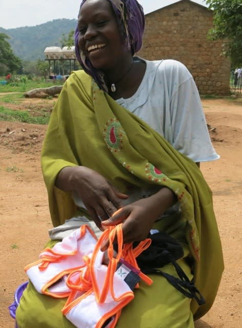 A woman with the Dignity Kit supplied by Alpine Group. - Credit: Courtesy of Alpine Group